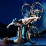 Two wheelchair dancers