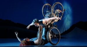Two wheelchair dancers