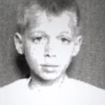 Black and white photo of a young boy