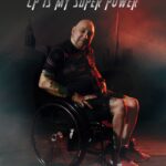 Peter in his wheelchair in a superhero pose
