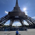 Bald man in a wheelchair at the Eiffel Tower